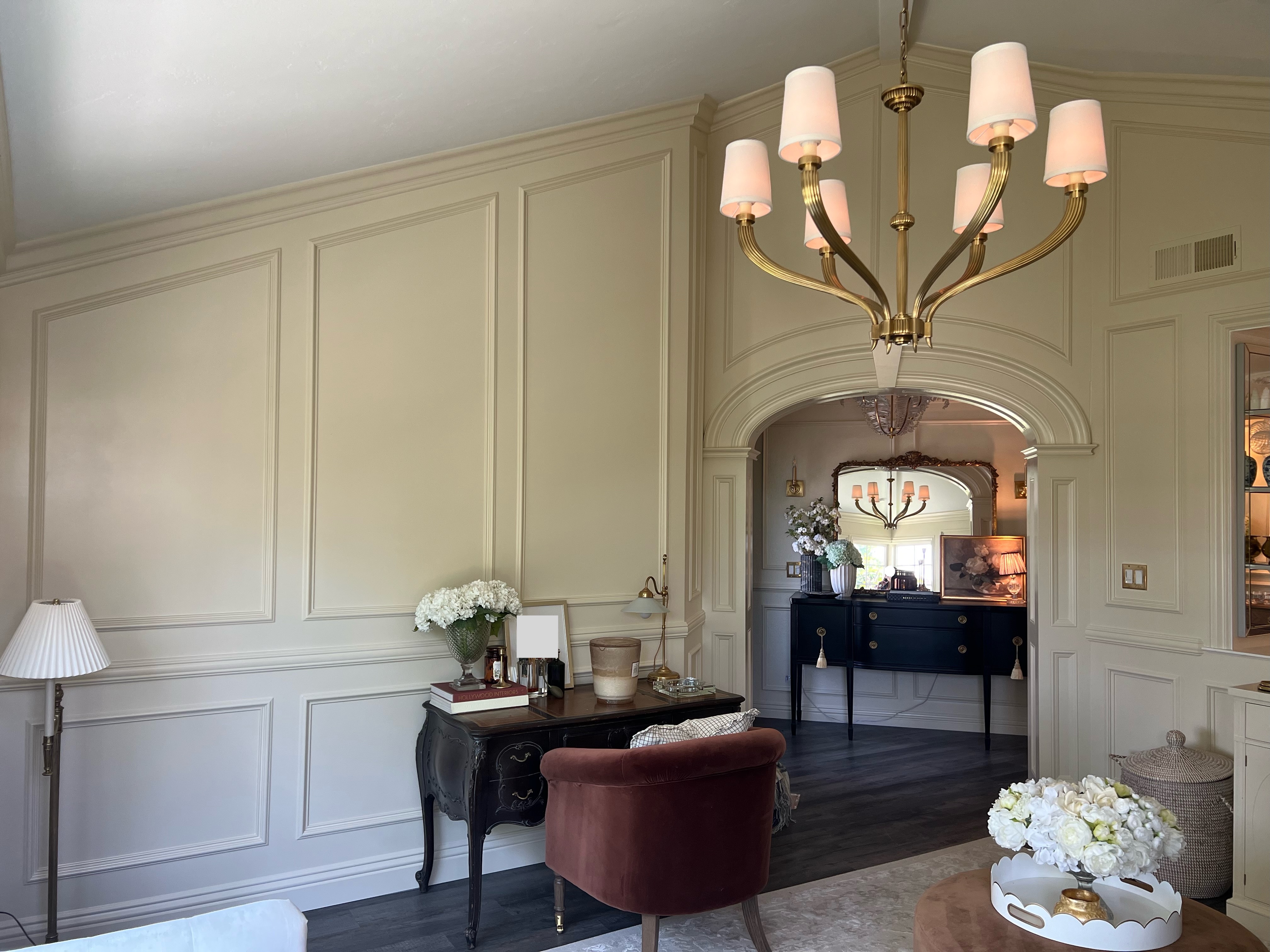 Floor to ceiling wainscoting and curved millwork accent wall